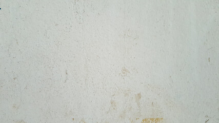 An old white concrete wall used as a background.