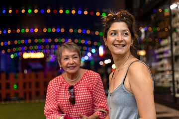 Two women share a time together,  Medellín.