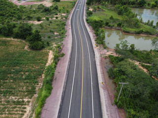 Obraz na płótnie Canvas Country roads, farmland and green forests, drone aerial shot