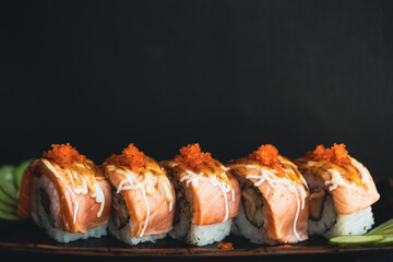 Salmon Sashimi and roll in Japanese restaurant.Fresh salmon fillet on bamboo plate and sushi roll.Asian people eating sashimi set Japan restaurant.salmon sashimi.Asian Food Menu.seafood sashimi.food.