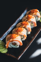 Salmon Sashimi and roll in Japanese restaurant.Fresh salmon fillet on bamboo plate and sushi roll.Asian people eating sashimi set Japan restaurant.salmon sashimi.Asian Food Menu.seafood sashimi.food.