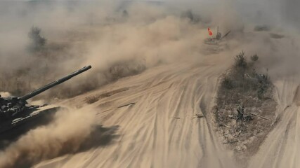 Two tanks drive road dust aerial. Army training. Military armored machine. National defense. Power demonstration vehicle riding at dry clouds desert field. Armoured transport. Battlefield cinema scene