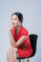 Woman wearing red Chinese dress, asian girl