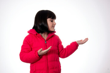 girl  wearing red coat on white background presenting