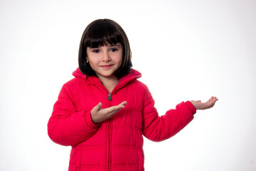 girl  wearing red coat on white background presenting