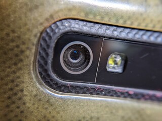 Close-up of smartphone camera lens with led flashlight