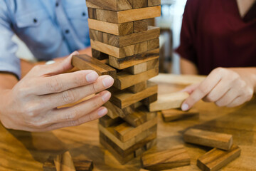 Man hand arranging wood block stacking.Business planning development