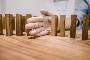 Man hand arranging wood block stacking.Business planning development