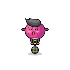 The cute onion character is riding a circus bike