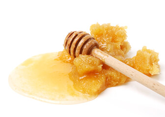 naturally crystallized rape honey on white wooden