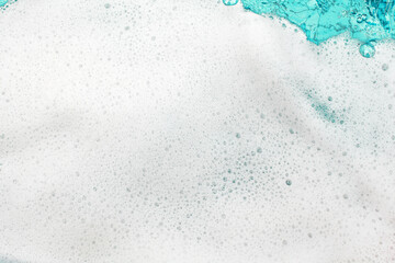 White foam blue water background closeup, sea or ocean foam wave pattern, froth bubbles texture,...