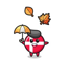 cartoon of the cute denmark flag badge holding an umbrella in autumn