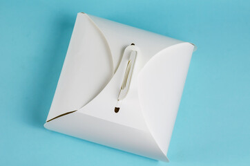 Takeaway food. White Paper Cake or Lunch Box on light blue backg