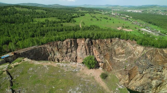 tectonic fault in the mountain, drone flyby, aerial video. forest and mountain lake, a beautiful unusual place that attracts travelers and lovers of bungee jumping. tuimsky failure, Russia