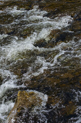 Water Flowing Over Several Rocks
