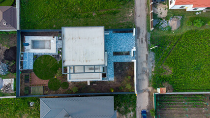 Top view flat roof with air conditioners and hydro insulation membranes on top of a modern...