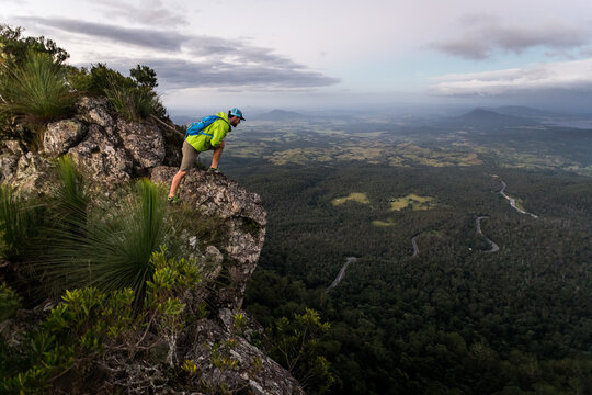Man looking out from mountain top