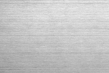 Shiny silver polished metal background texture of brushed stainless steel plate with the reflection...