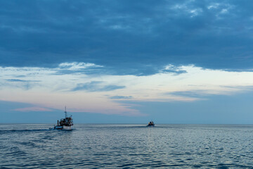 adriatic sea with fisher boats in sunset