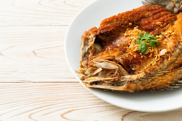 Fried Sea Bass Fish with Garlic