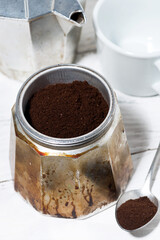 ground coffee in a geyser coffee machine, vertical top view