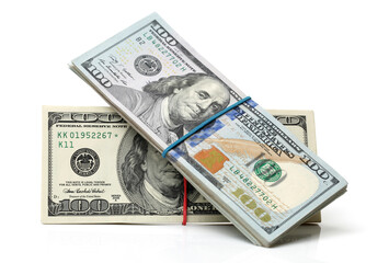 Many bundle of US 100 dollars bank notes isolated on white background 