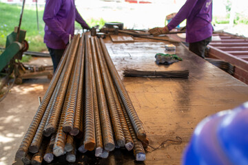 worker on the site iron on the table at worksite 