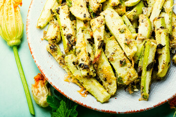 Roasted zucchini sticks with greens