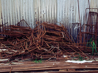 Rusted round steel. heap of the metallic building rubbish.