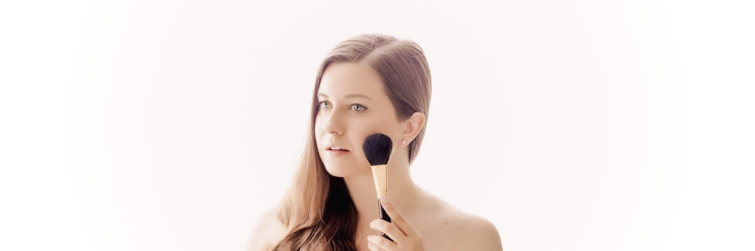 Beautiful Woman With Makeup Brush, Perfect Skin And Shiny Hair As Make-up, Health And Wellness Concept. Face Portrait Of Young Female Model For Skincare Cosmetics And Luxury Beauty Ad Design.