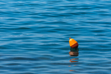 red buoys on the blue sea