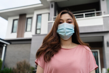 woman wearing face mask for protect coronavirus (covid-19) at home