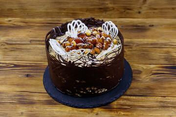 Tasty chocolate cake on a wooden table