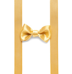 Beautiful golden ribbons with bow on white background