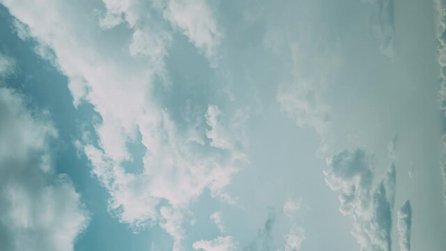Vertical Shot, vertical Clouds Cloud Sky Blue Moving In Cloudy Sky With Clouds. Natural Background Cloudscape 4K Time Lapse, Timelapse, Time-lapse. 4K Blue Background. Abstract Blue. Cloud veiled