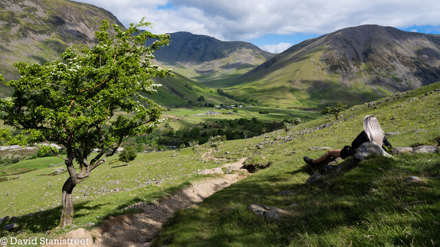 Lady hiker viewing Wasdale Head at the start of Scafell Pike ascent 