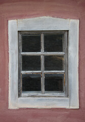 Old window on a wooden wall. Architecture.