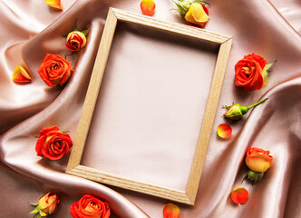 Flowers composition. Wooden frame and red  roses and leaves