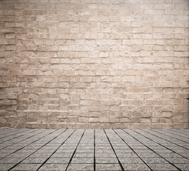Empty room with bricks wall and tiled floor.