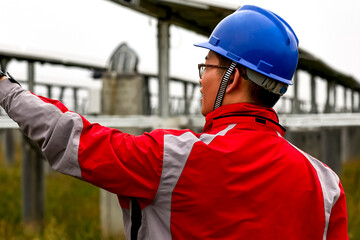 Asian workers are inspecting the solar photovoltaic area