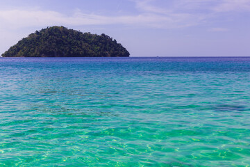 Fototapeta premium island in the calm sea clear water and blue sky