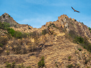 Impregnable ethnic village on the top of a mountain. Old abandoned ghost town of Gamsutl, Dagestan,...