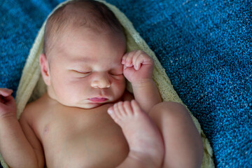 Newborn baby boy, sleeping happily