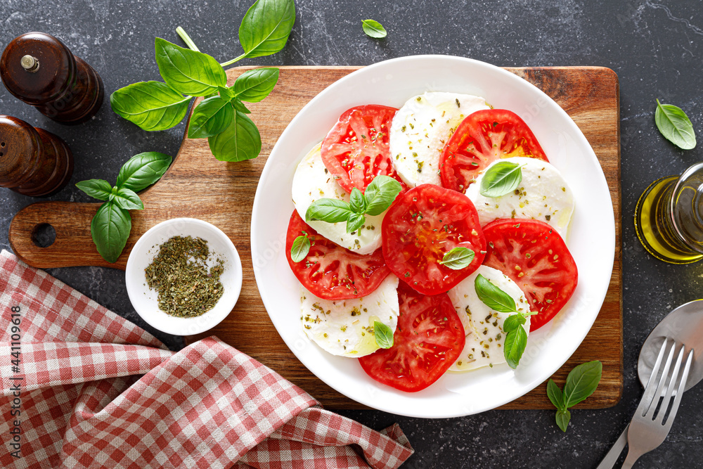 Canvas Prints caprese salad with fresh tomatoes, basil and mozzarella cheese, top view