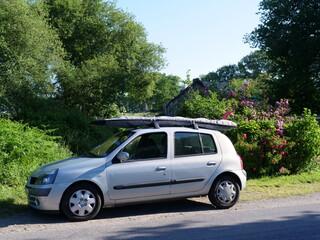 A car with a surfboard. France.