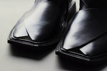 A very famous pair of handmade black sandals of Peshawar, Pakistan