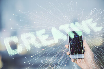 Double exposure of creative hologram and woman holding and using a mobile device. Start up concept.
