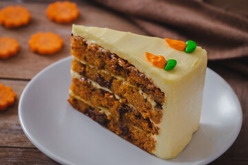 Slice of carrot cake on white plate
