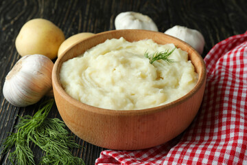 Concept of tasty eating with mashed potatoes on wooden table
