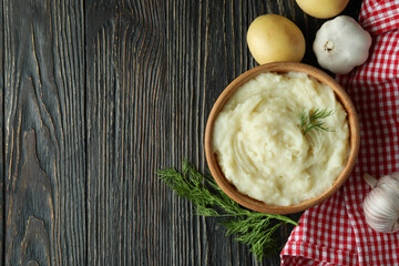 Concept of tasty eating with mashed potatoes on wooden table